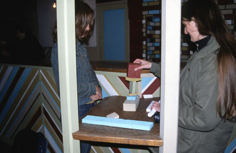 Playstation at Area 10. Miniatures at The Bar. Sarah Knowler playing. Interactie installation. 2004.